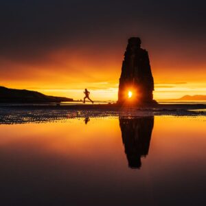 A Man Is Running At Beach At The Time Of Sunset